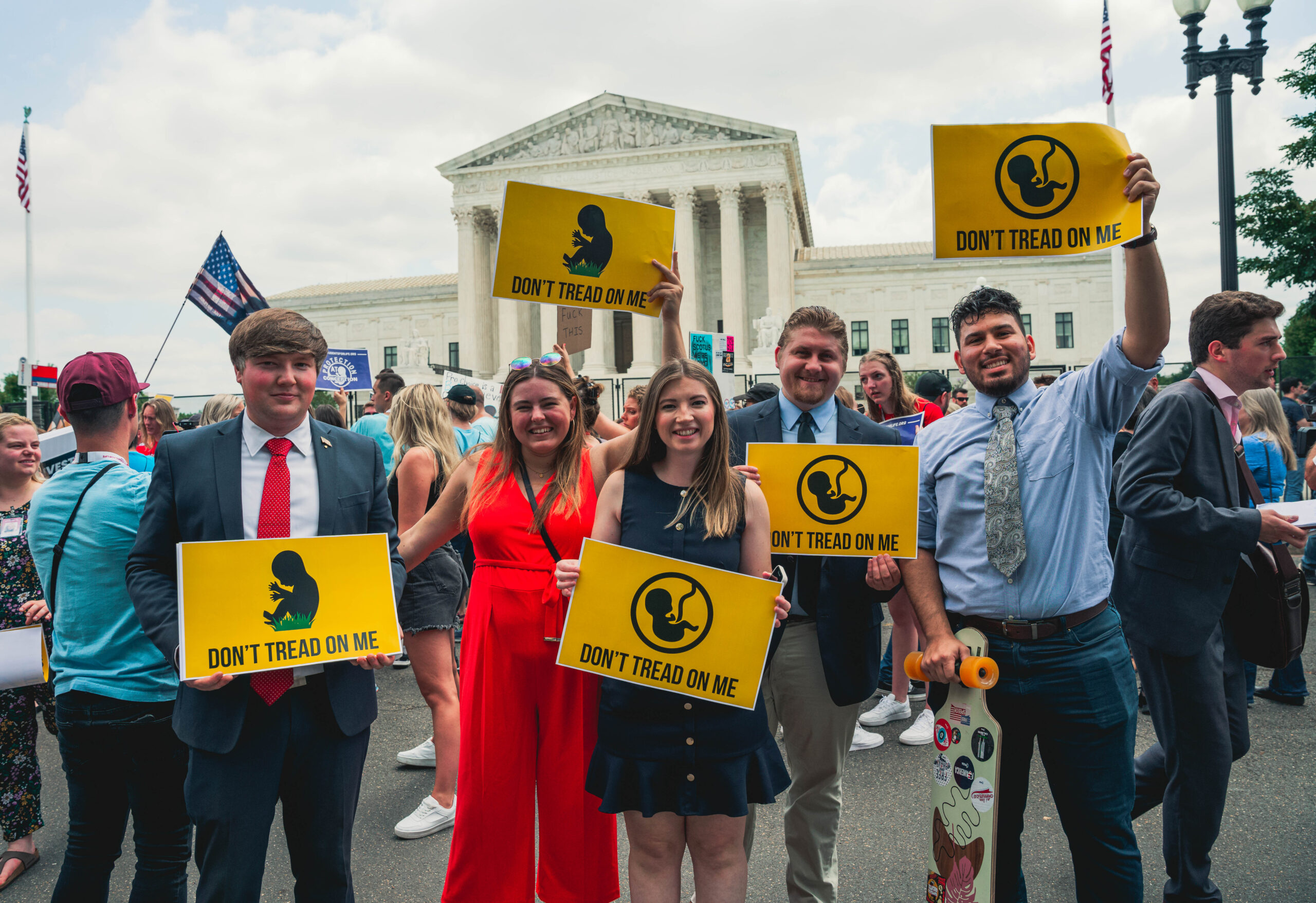 Leadership Institute activists hold "Don't Tread on Me" signs during a pro-life demonstration outside the U.S. Supreme Court. The group poses together in front of the Supreme Court building while participating in the rally.
